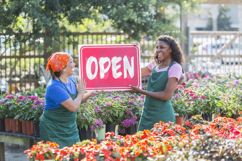 Explore creative and eye-catching flower stand arrangements to make your grand opening truly special